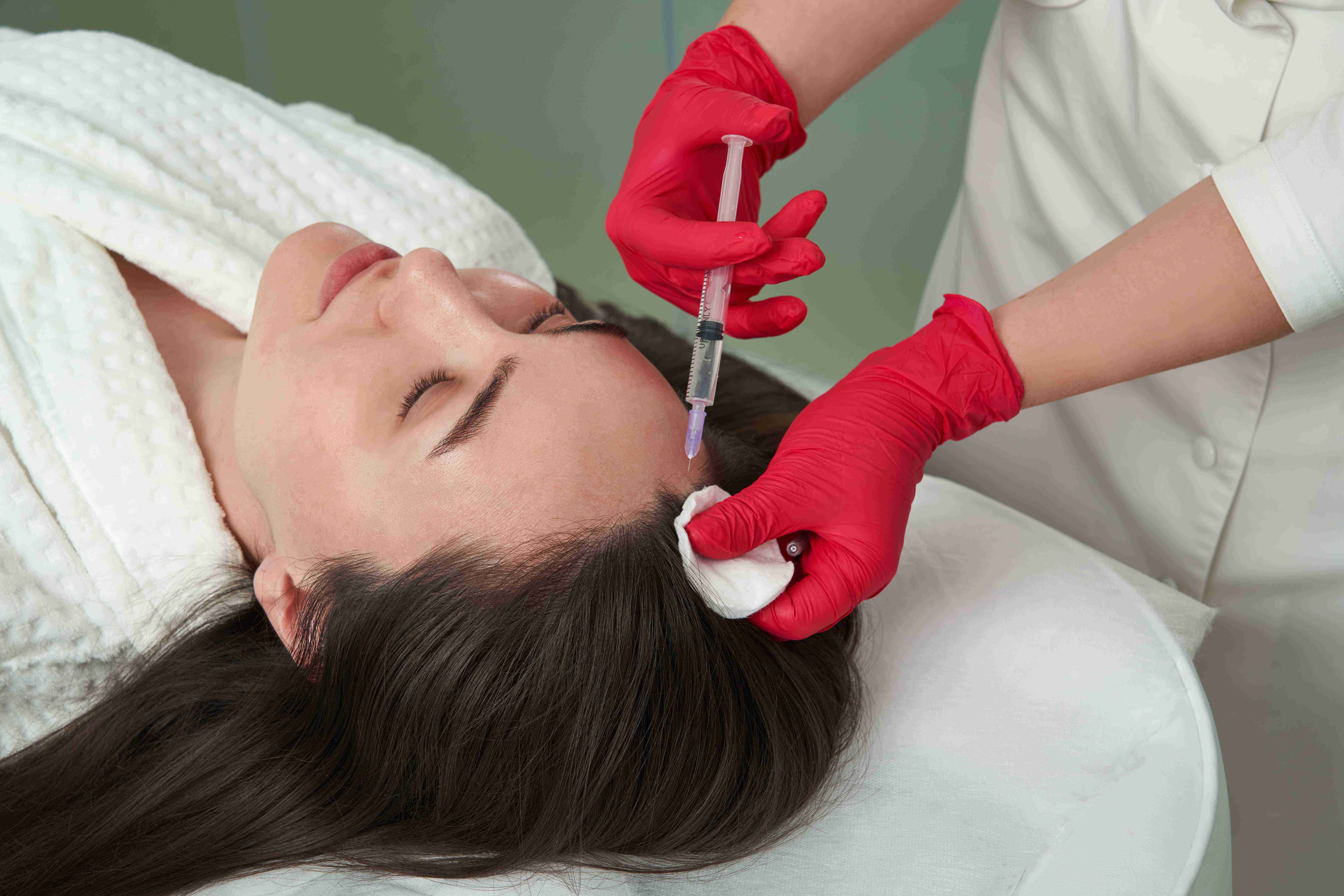 Woman using facial massage tools