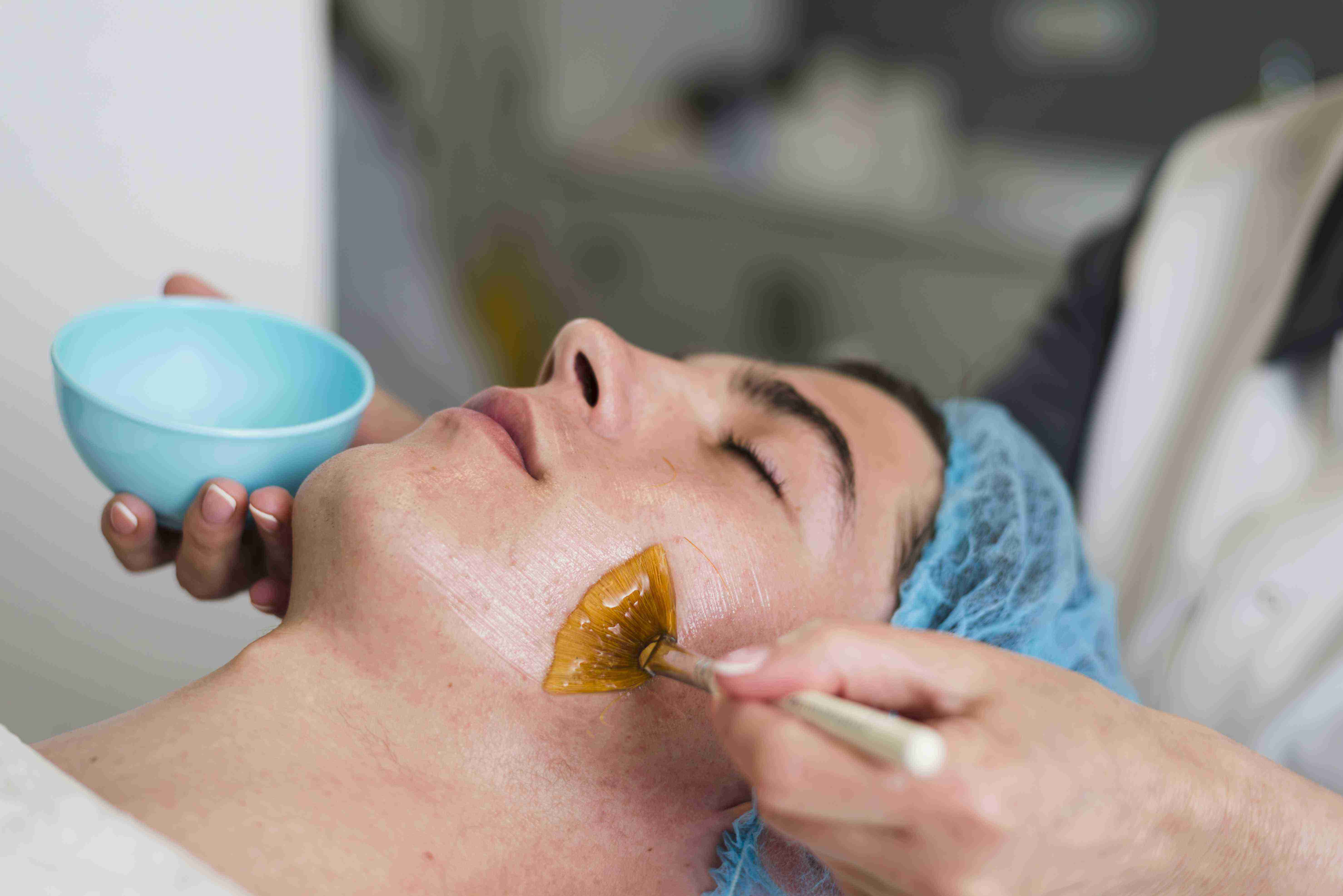 Woman using facial massage tools