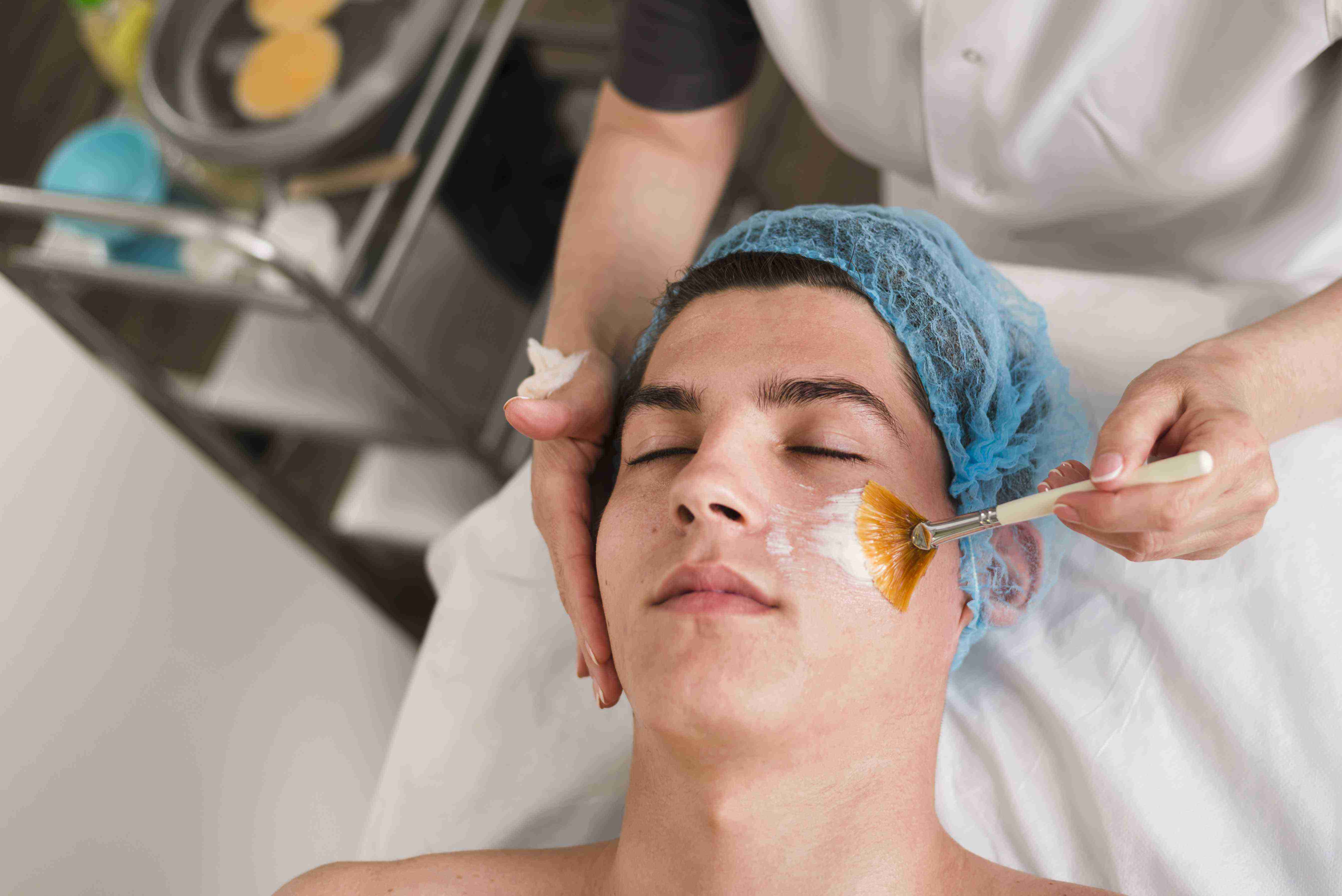 Woman using facial massage tools