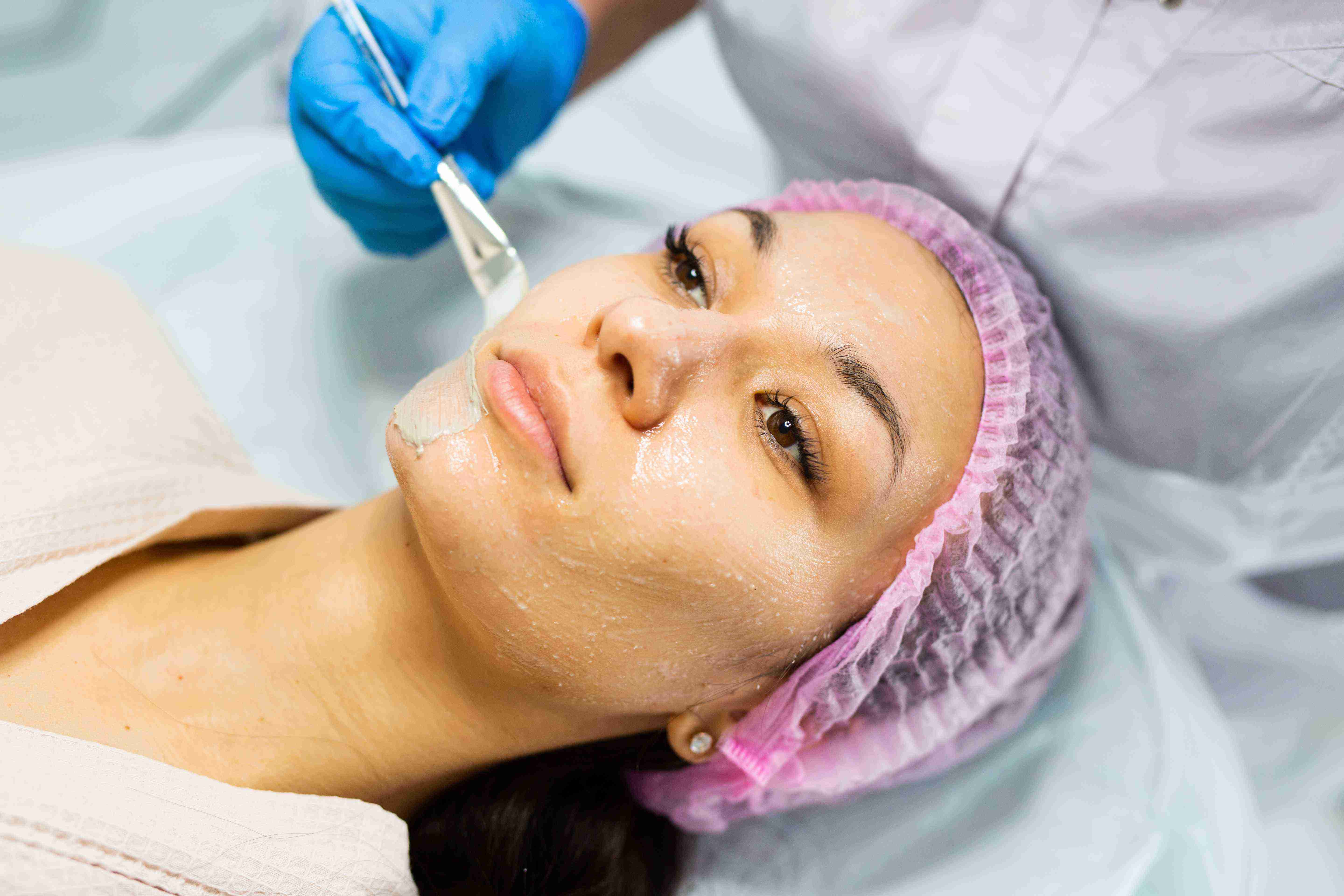 Woman using facial massage tools