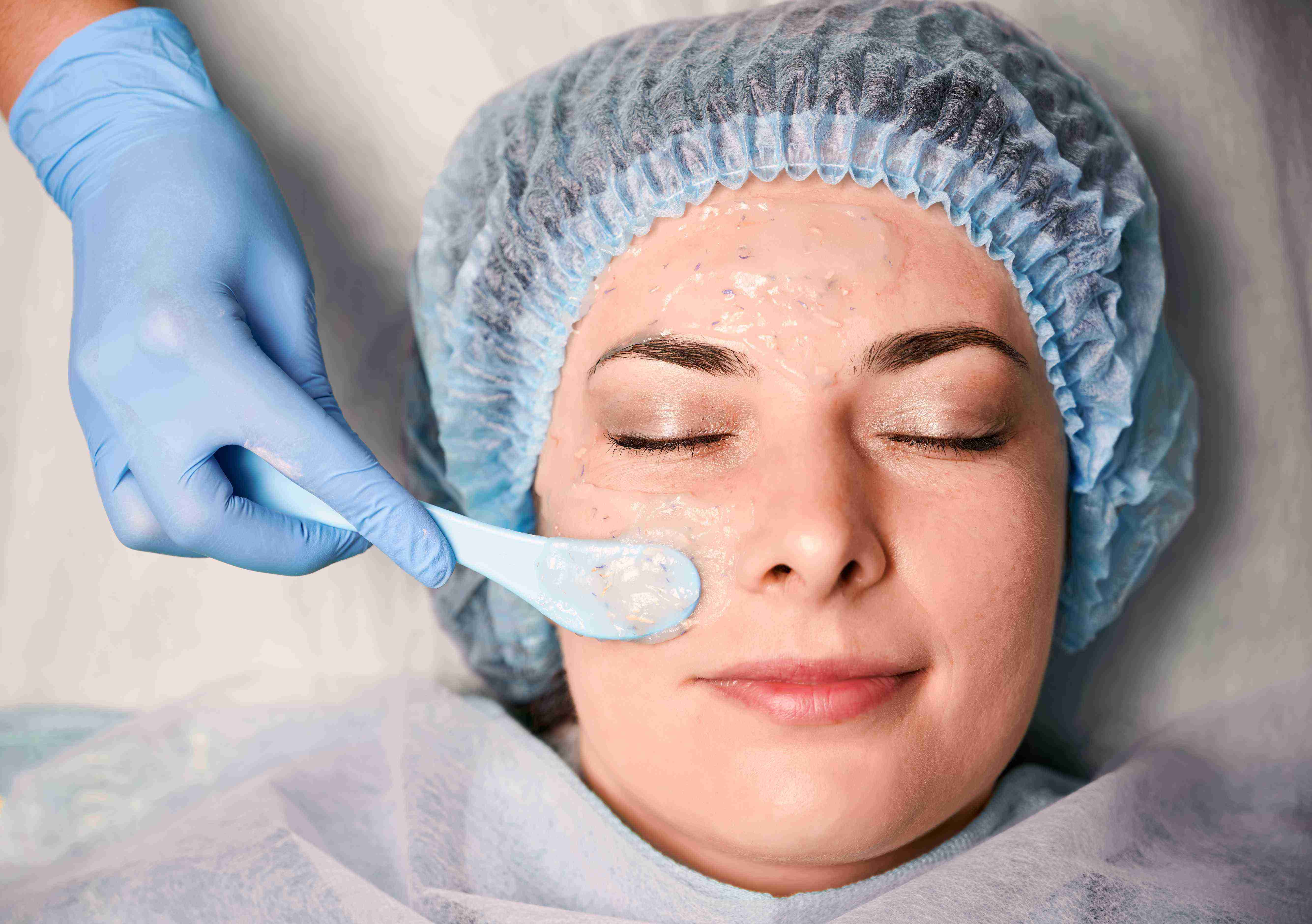 Woman using facial massage tools