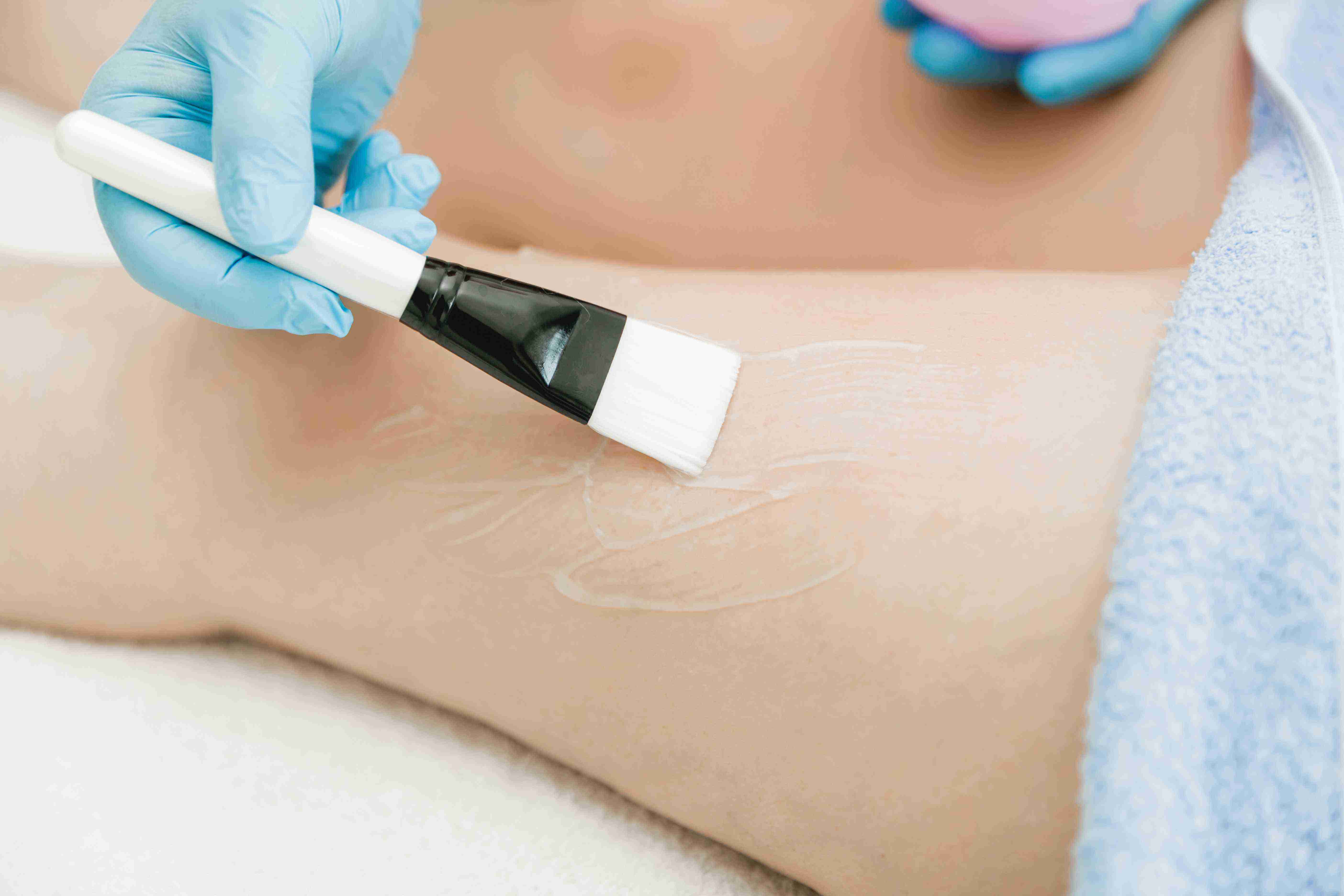 Woman using facial massage tools