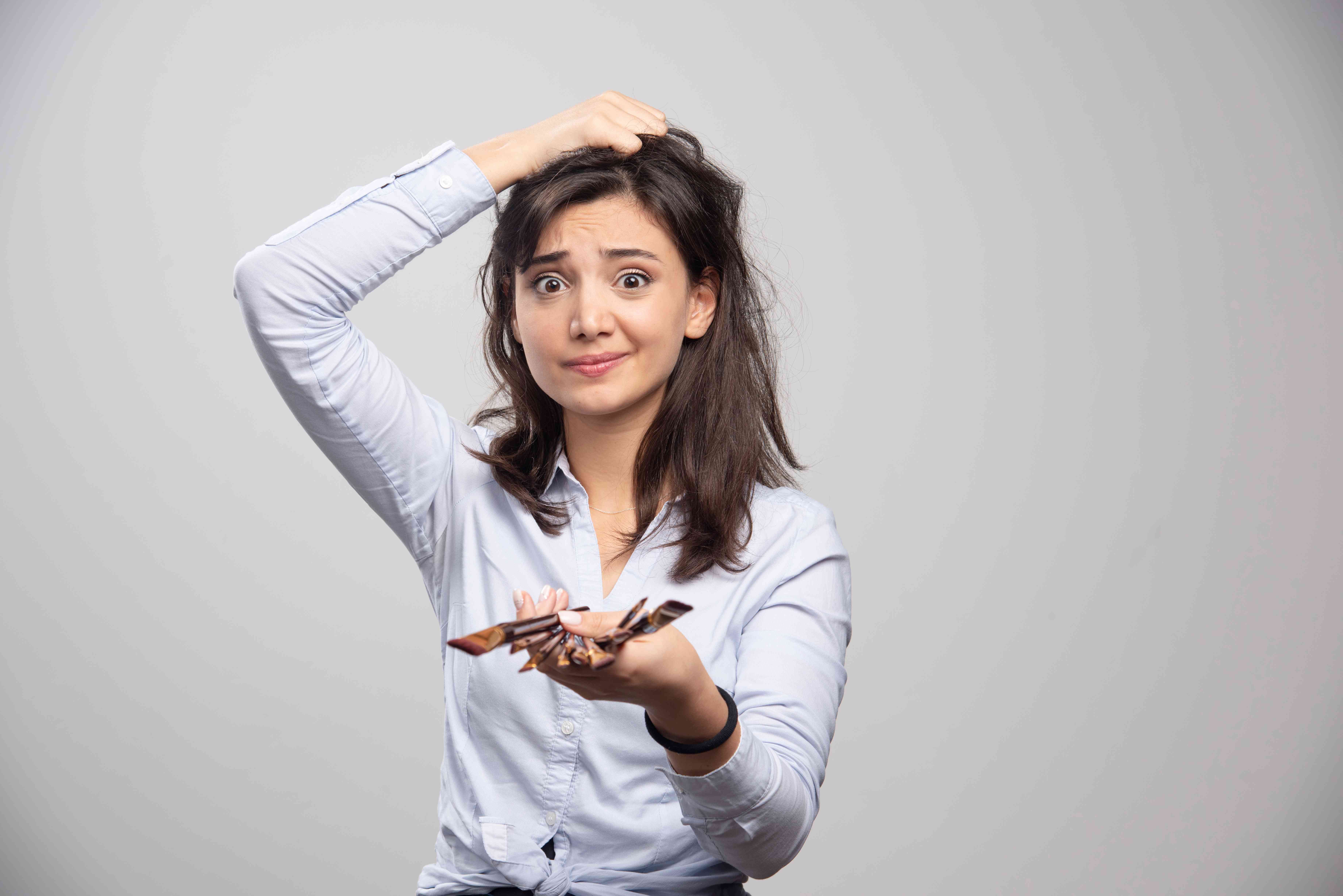 Woman using facial massage tools