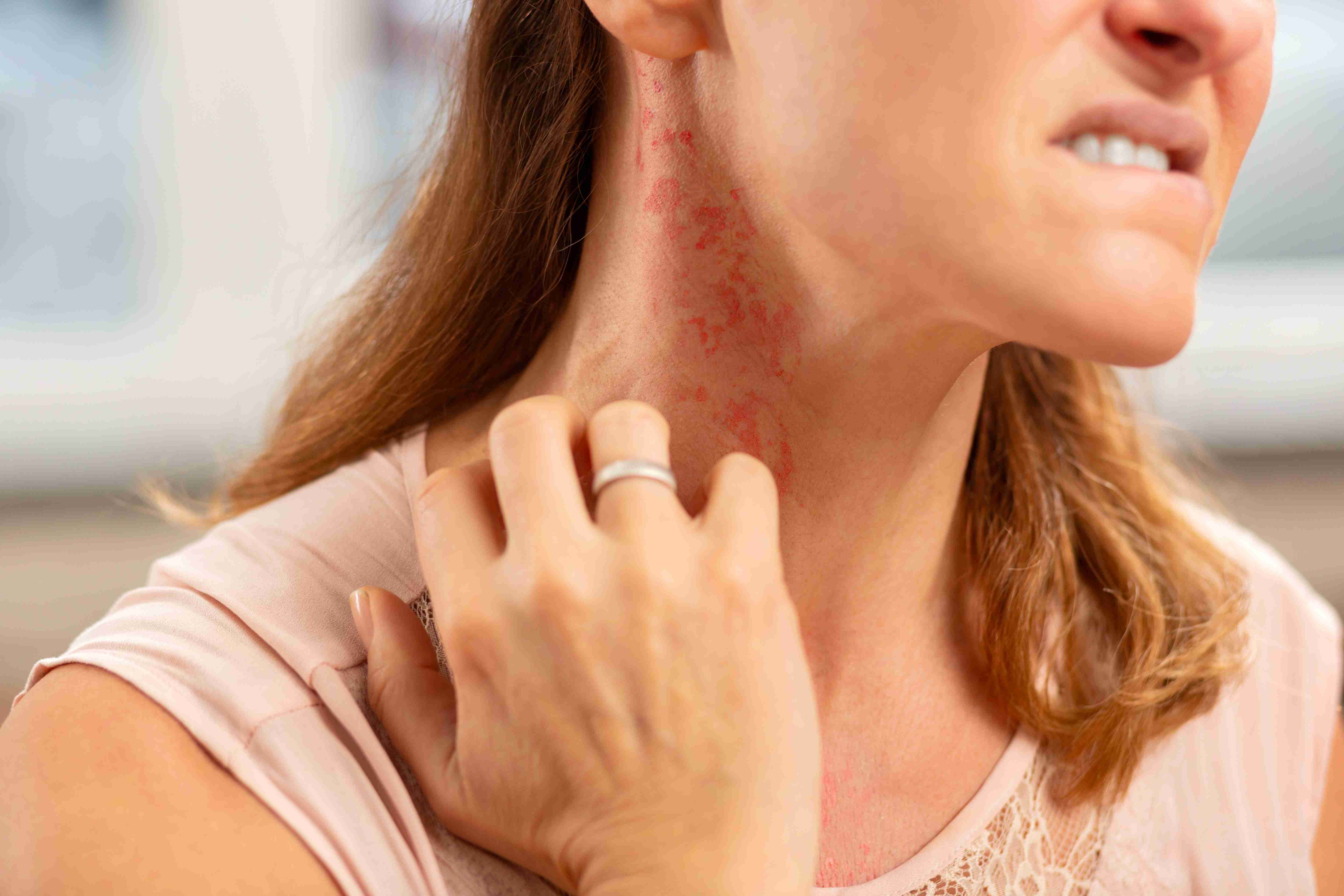 Woman using facial massage tools