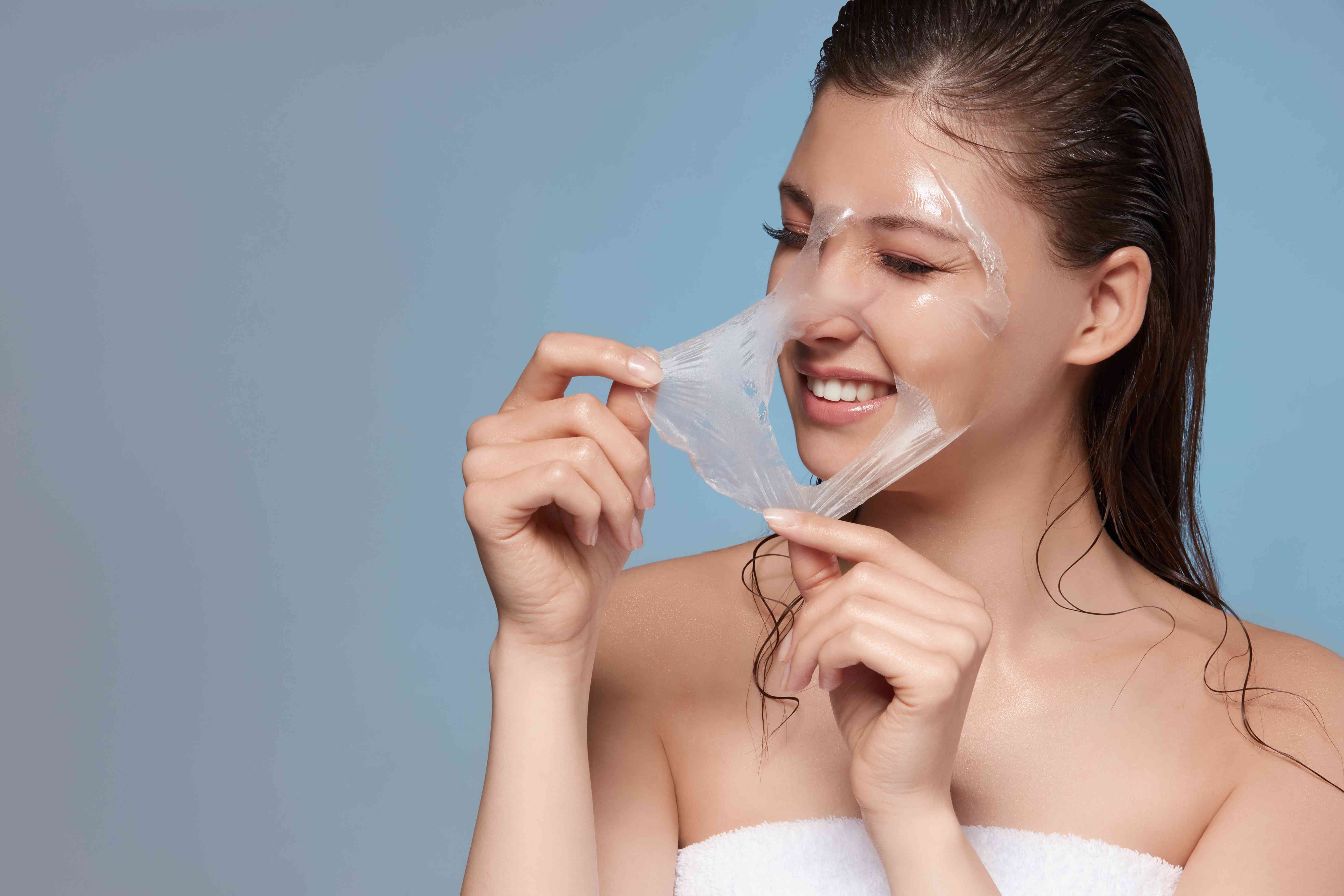 Woman using facial massage tools