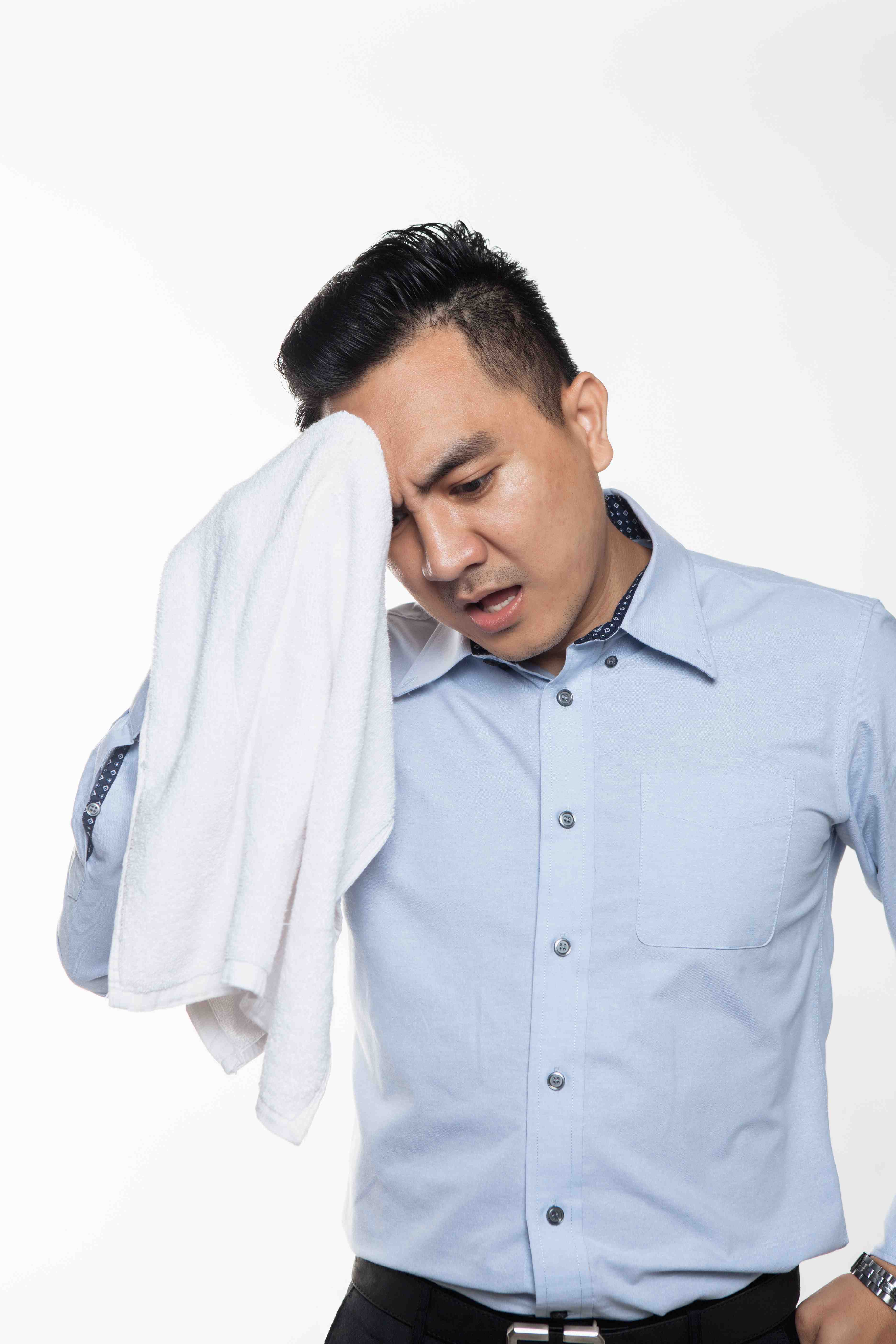 Dermatologist treating sweaty underarms with laser