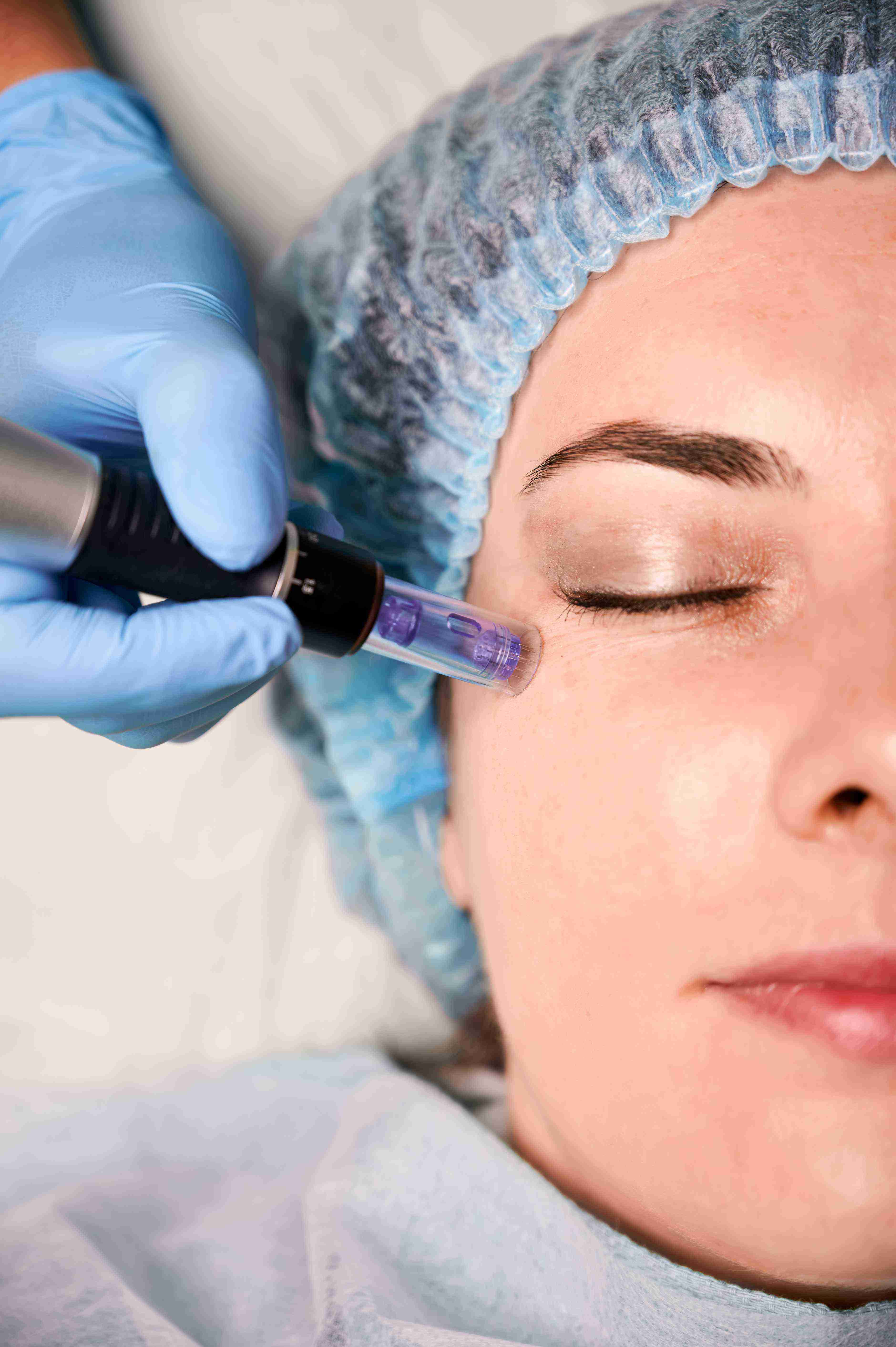 Woman using facial massage tools