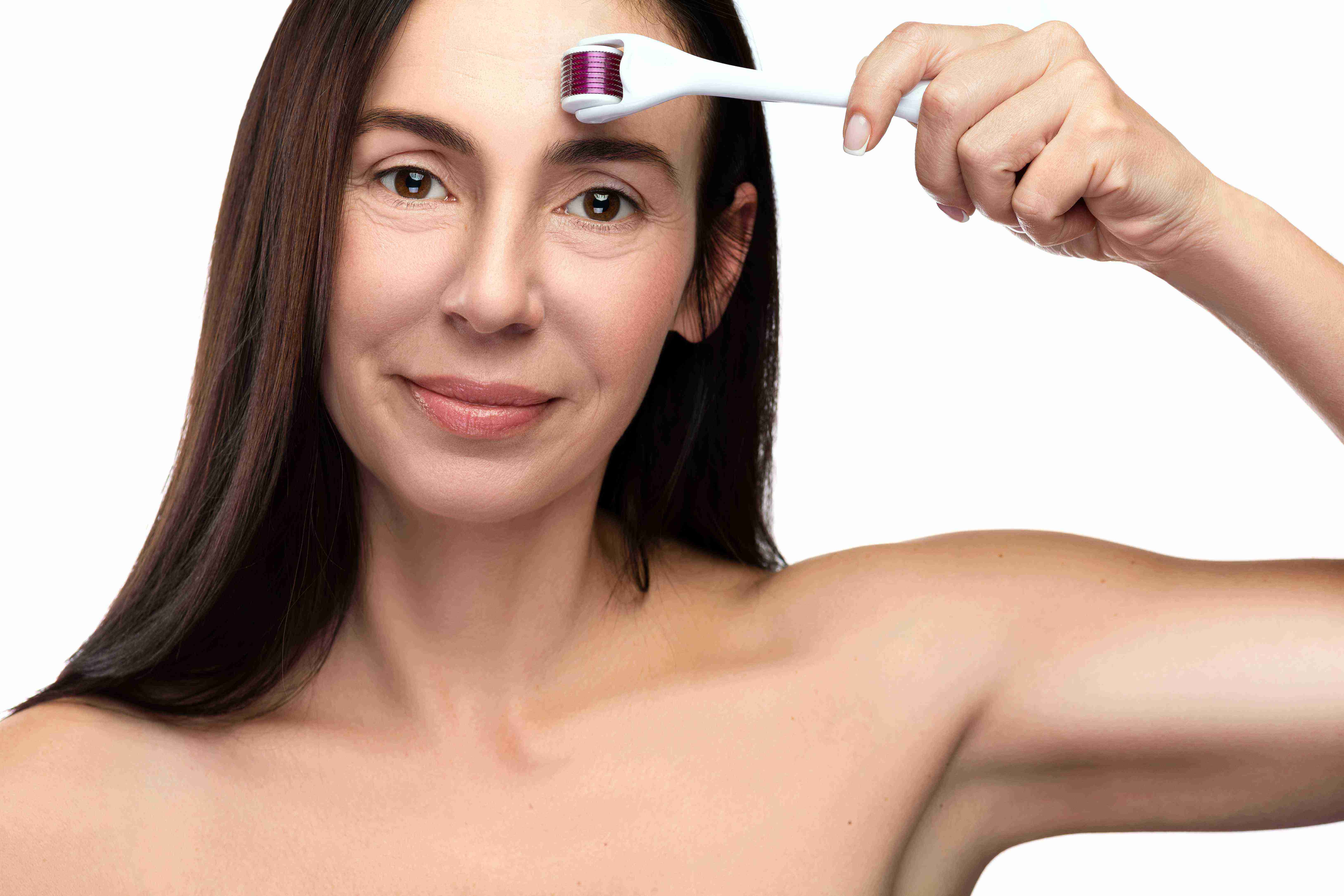Woman using facial massage tools