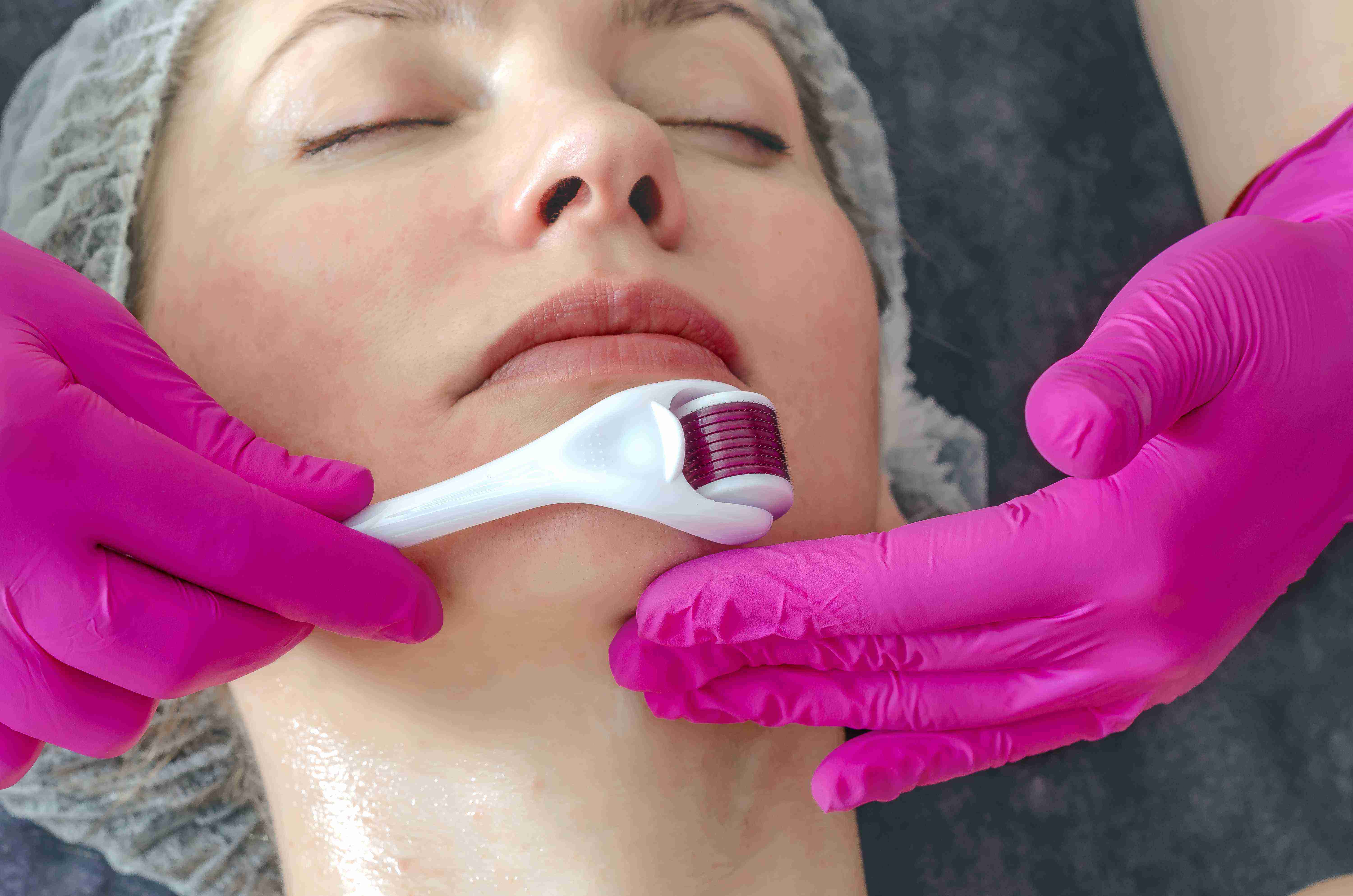 Woman using facial massage tools