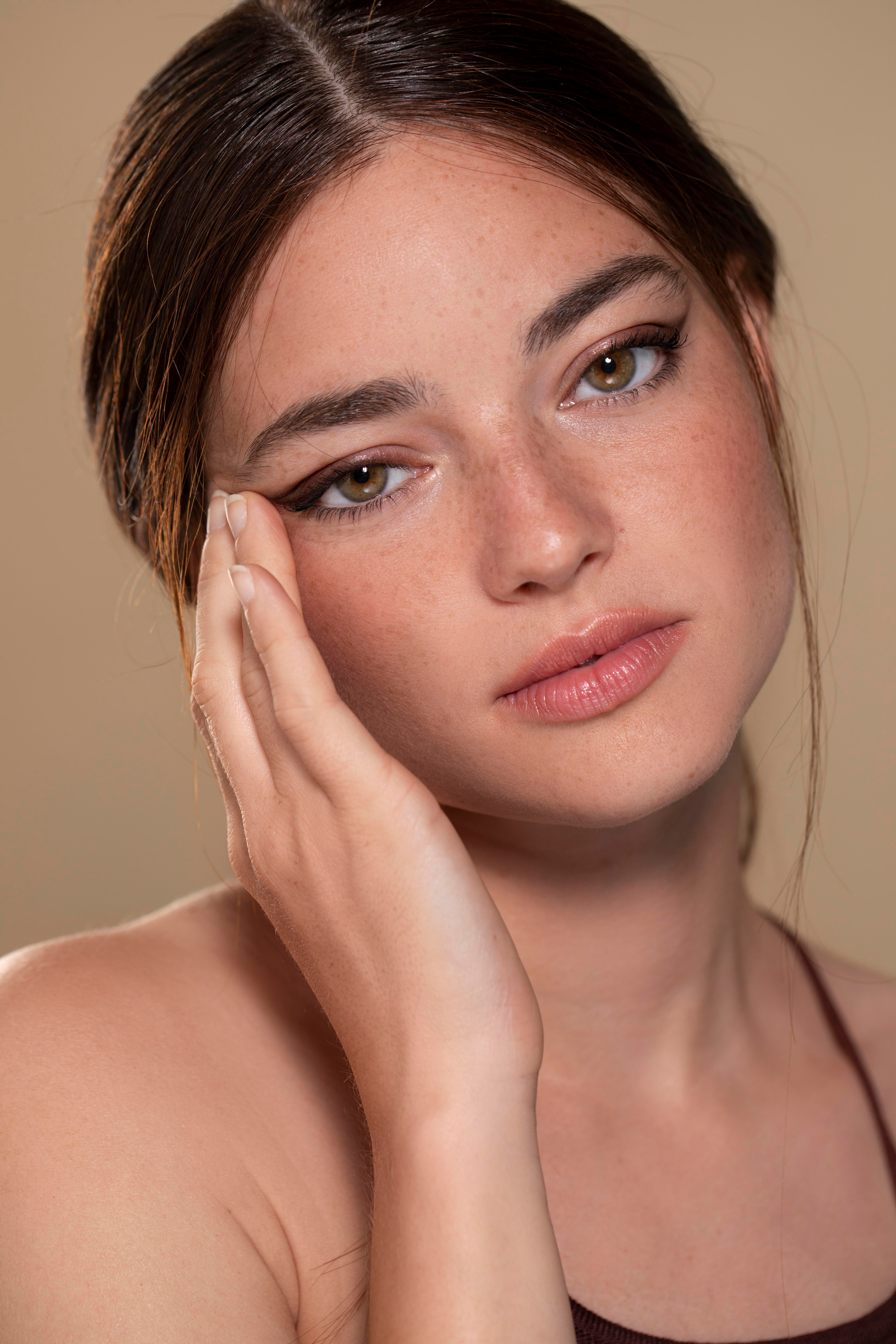 Woman touching face