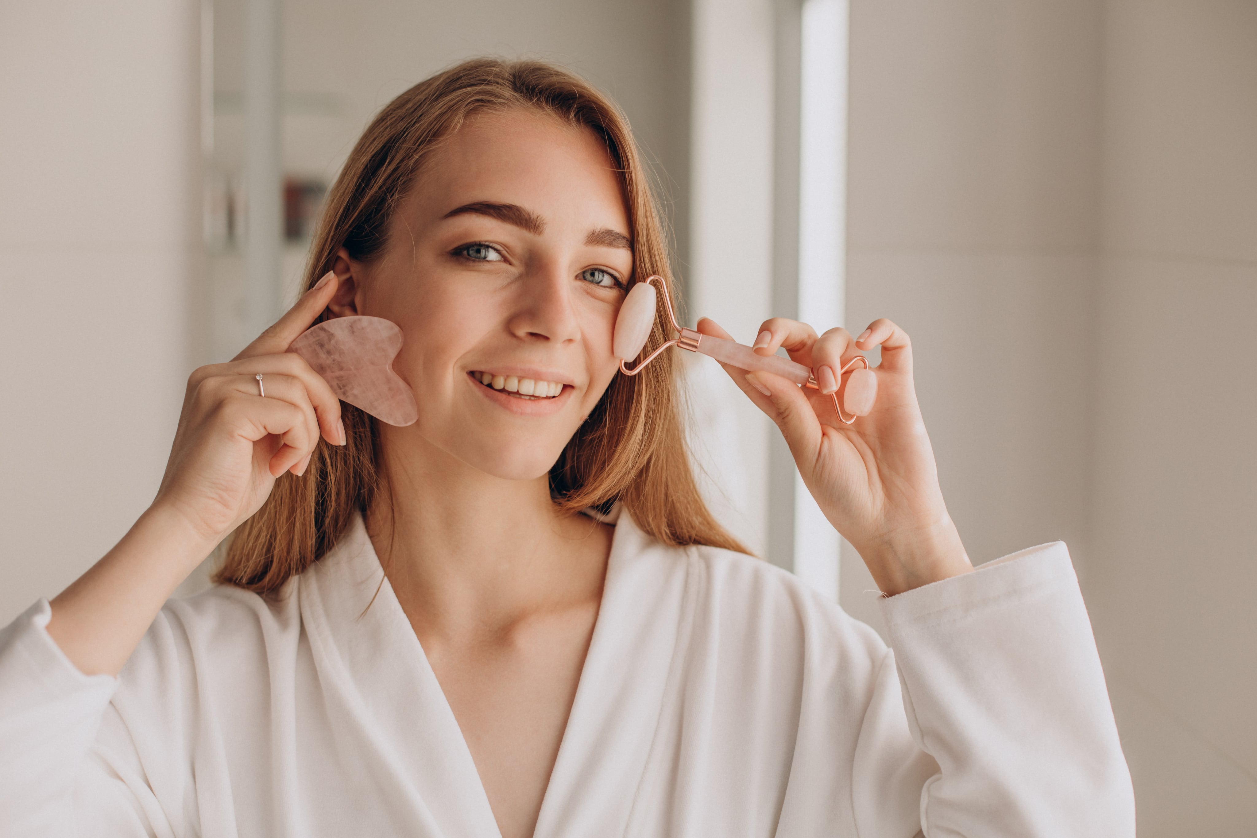 Woman using facial massage tools