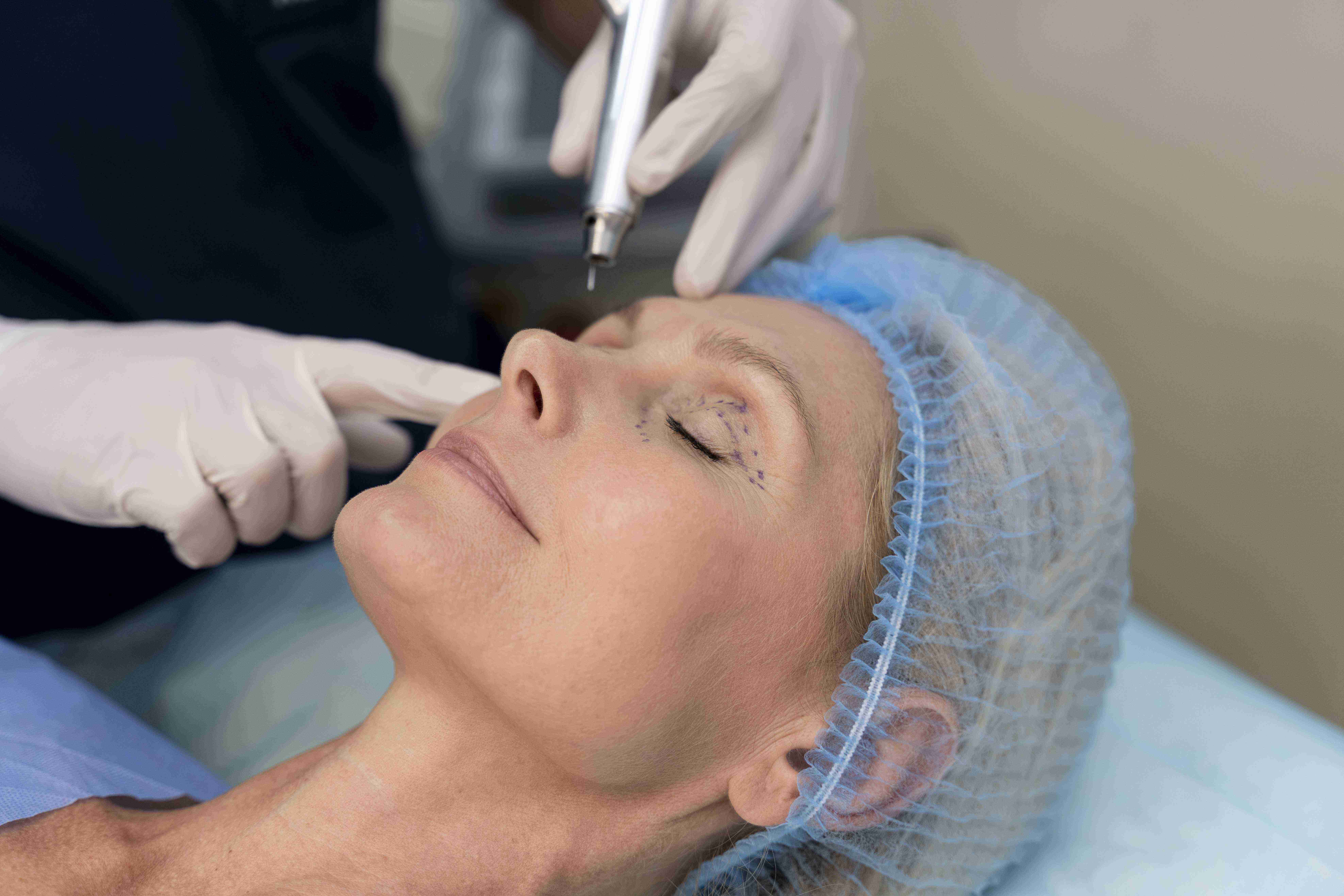 Woman using facial massage tools