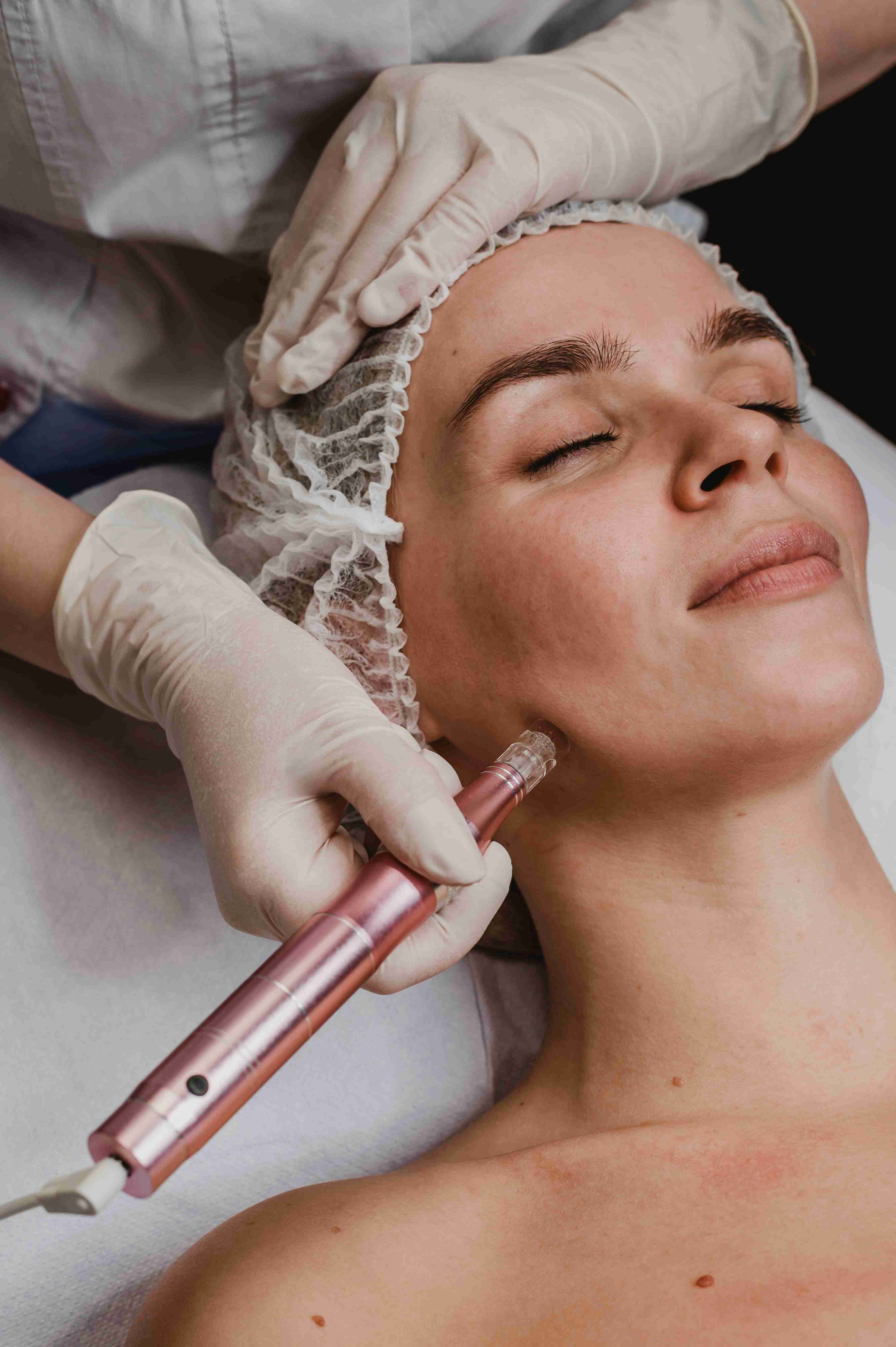 Woman using facial massage tools