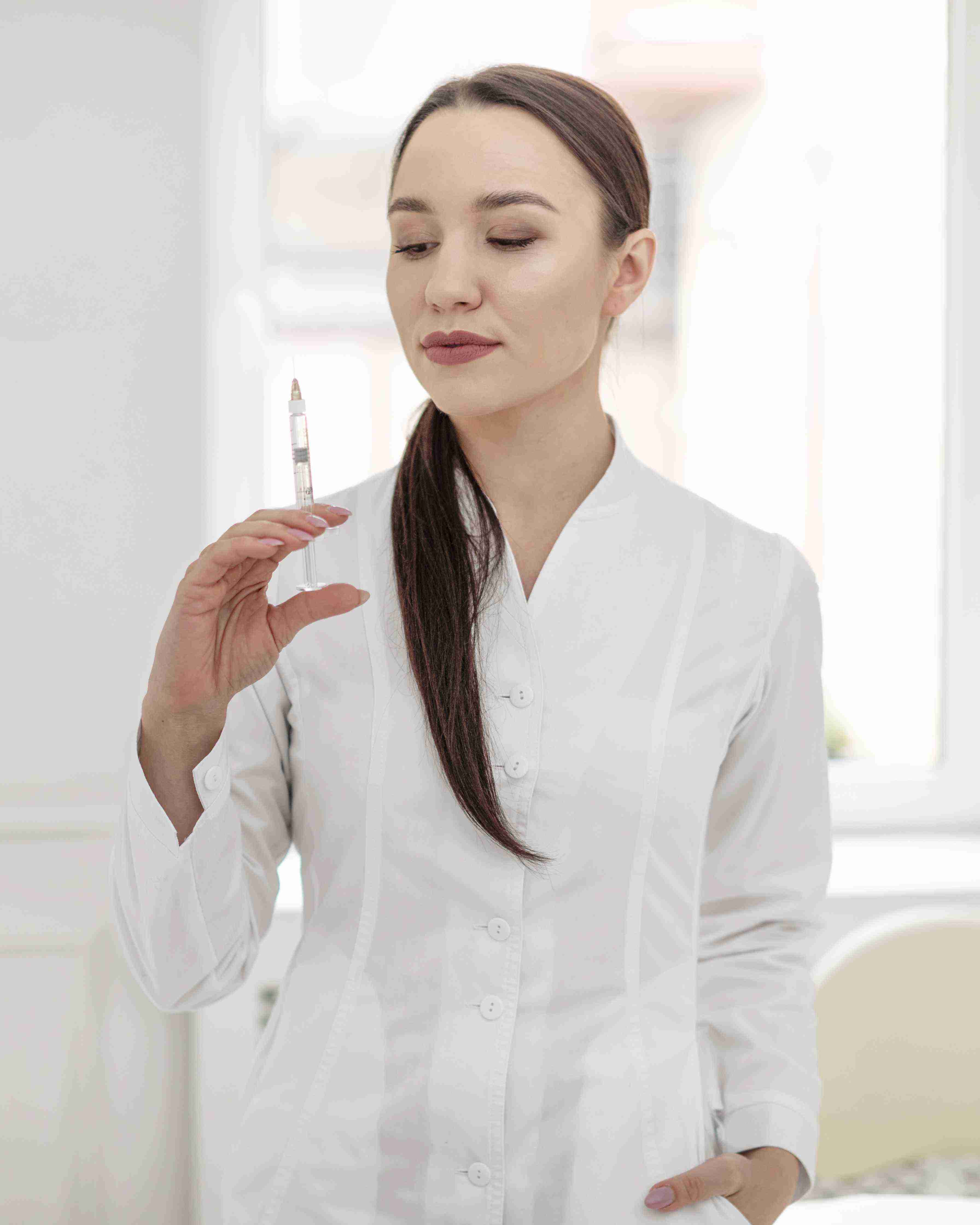 Woman using facial massage tools