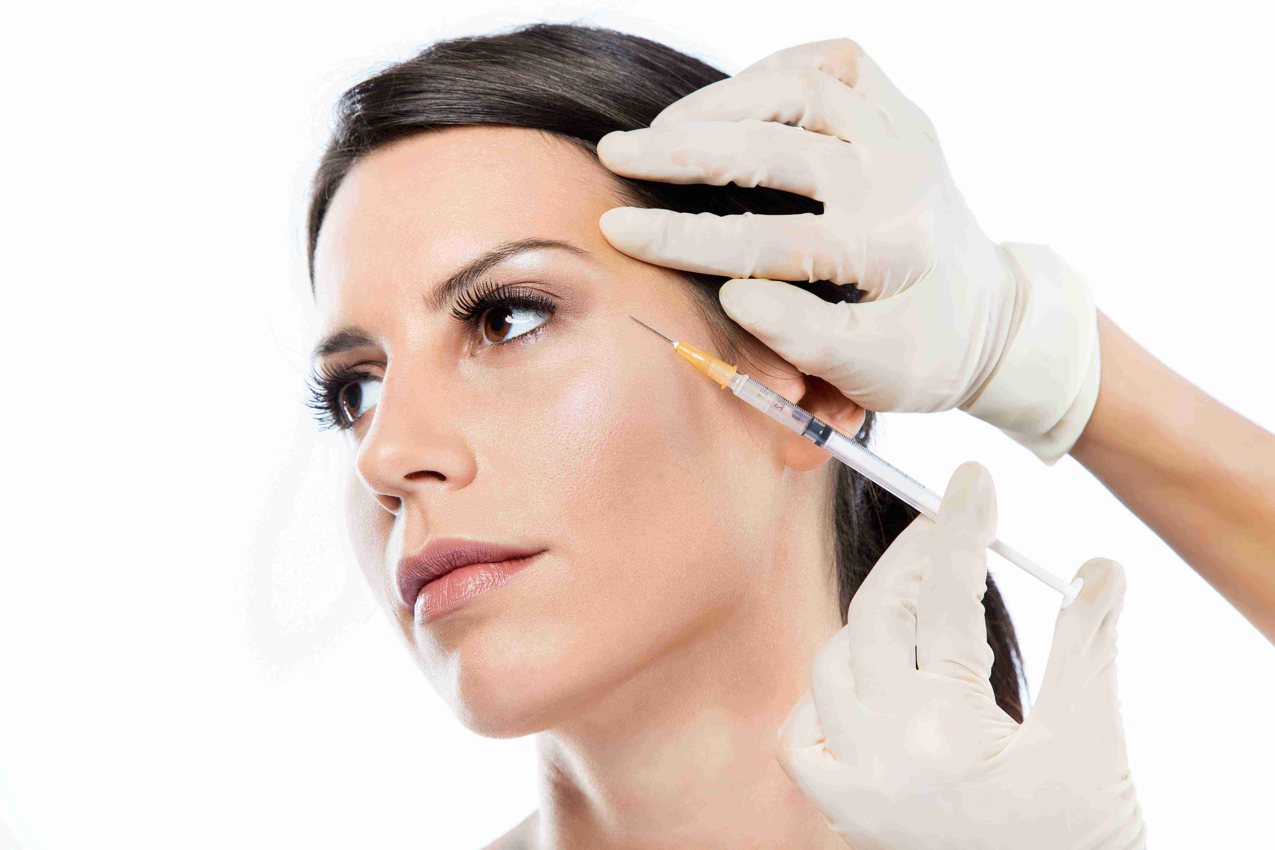 Woman using facial massage tools